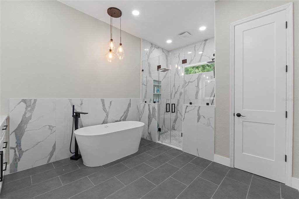 Bathroom, Free Standing Baths, Glass Shower, Interior, Marble Walls, Pendant Lights, Recessed Lighting