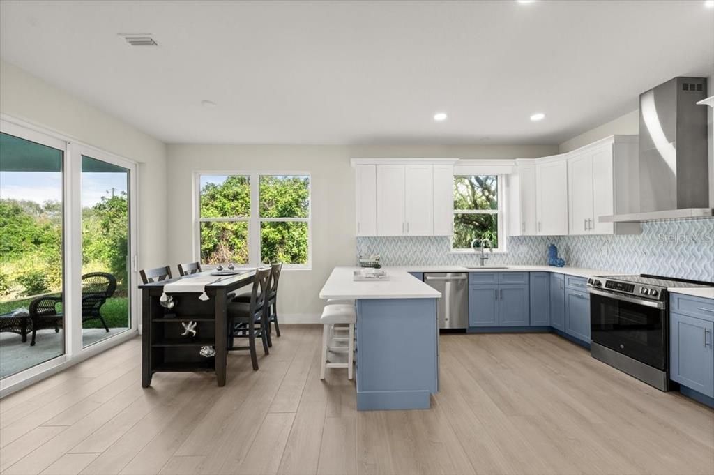 Dining room, Interior, Kitchen, Recessed Lighting, Stainless Steel Appliances, Wood Texture Flooring