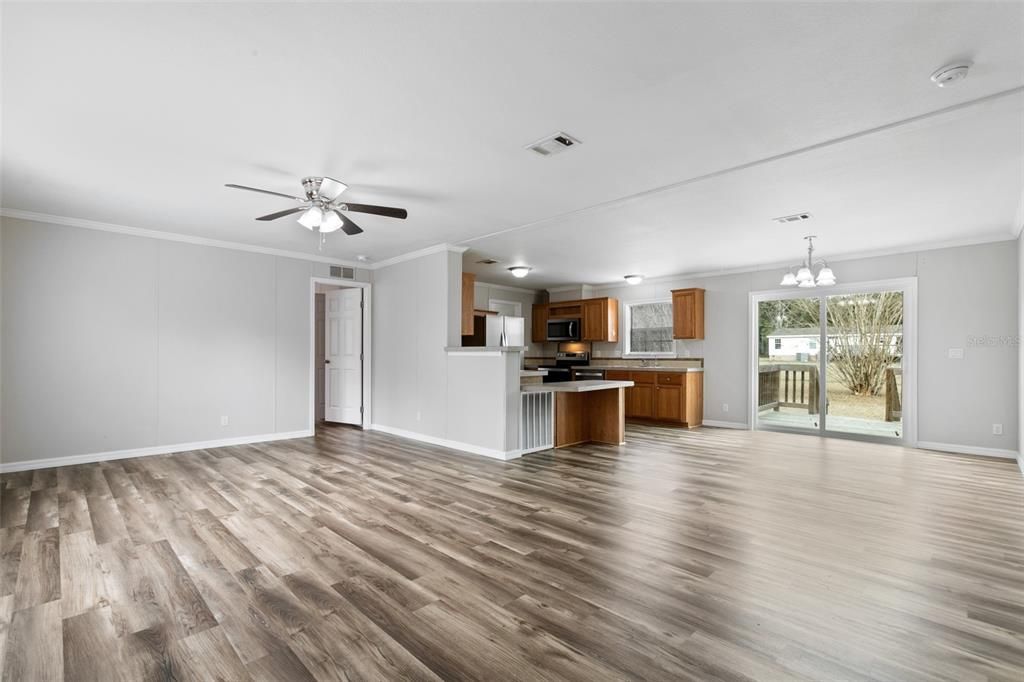 Empty room, Interior, Kitchen, Pendant Lights, Stainless Steel Appliances, Wood Texture Flooring