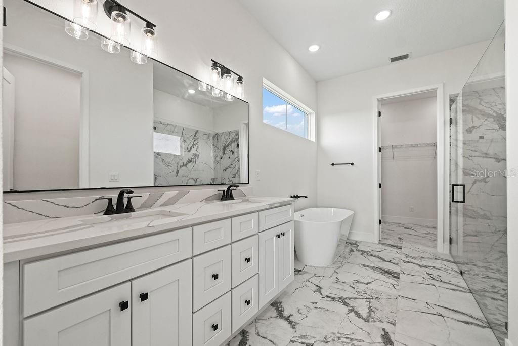 Bathroom, Dual Sink Vanities, Free Standing Baths, Glass Shower, Interior, Marble, Marble Walls, Recessed Lighting