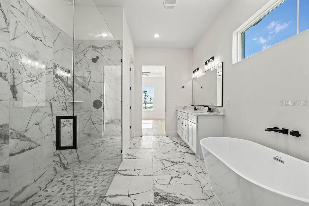 Bathroom, Dual Sink Vanities, Free Standing Baths, Glass Shower, Interior, Marble, Marble Walls, Recessed Lighting