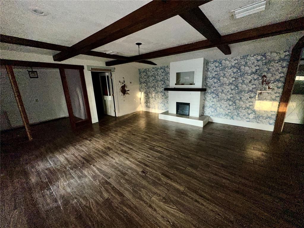Empty room, Fireplace, Interior, Stone Walls, Wooden Beams, Wood Texture Flooring