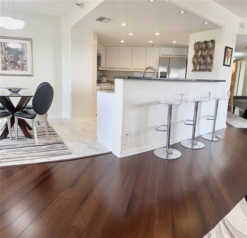 Dining room, Interior, Kitchen, Marble, Pendant Lights, Recessed Lighting, Stainless Steel Appliances, Wood Texture Flooring