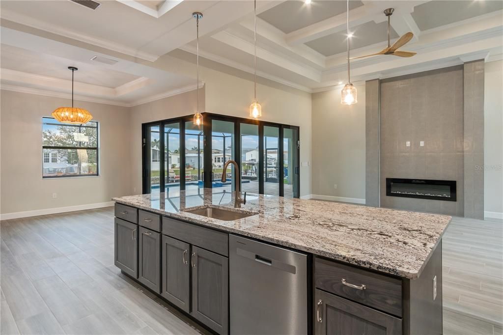 Fireplace, Interior, Kitchen, Pendant Lights, Stainless Steel Appliances, Wood Texture Flooring