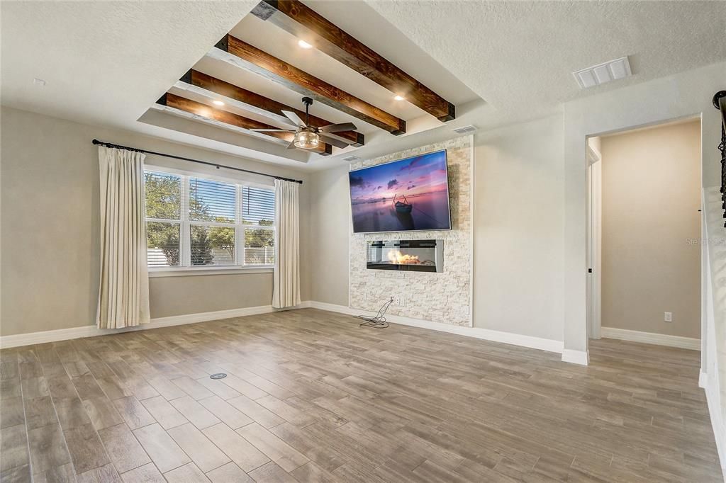 Empty room, Fireplace, Interior, Recessed Lighting, Wooden Beams, Wood Texture Flooring