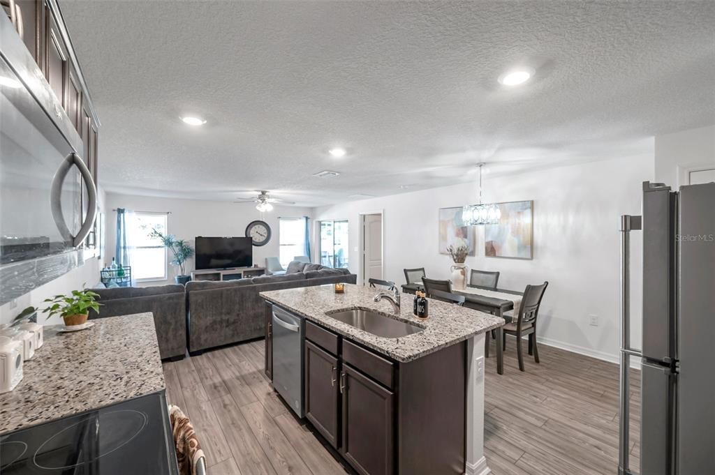 Chandelier, Dining room, Interior, Kitchen, Living room, Recessed Lighting, Wood Texture Flooring