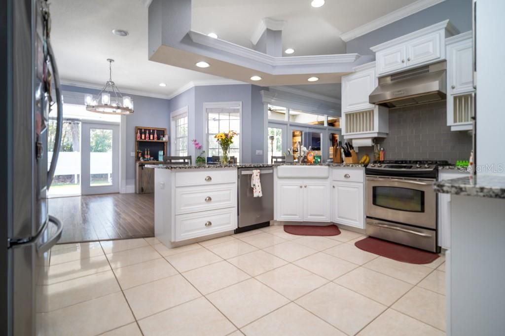 Chandelier, Interior, Kitchen, Pendant Lights, Recessed Lighting, Stainless Steel Appliances, Wood Texture Flooring