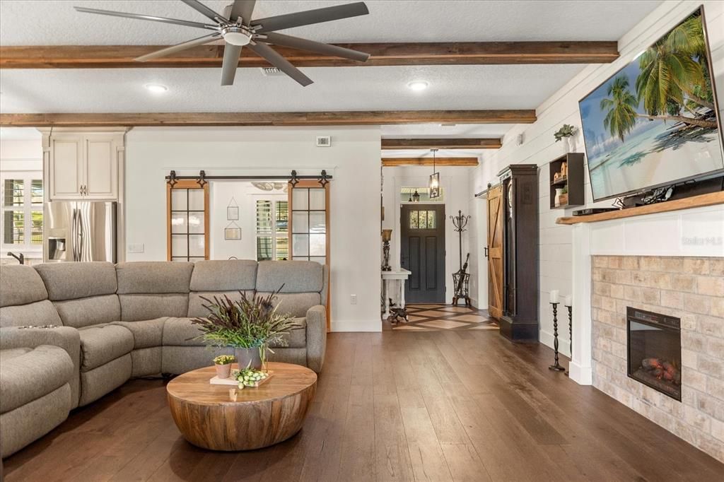 Fireplace, Interior, Living room, Pendant Lights, Recessed Lighting, Stone Walls, Wooden Beams, Wood Texture Flooring