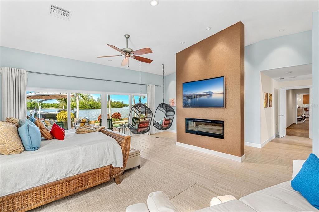 Bedroom, Fireplace, Interior, Recessed Lighting, Water, Wood Texture Flooring