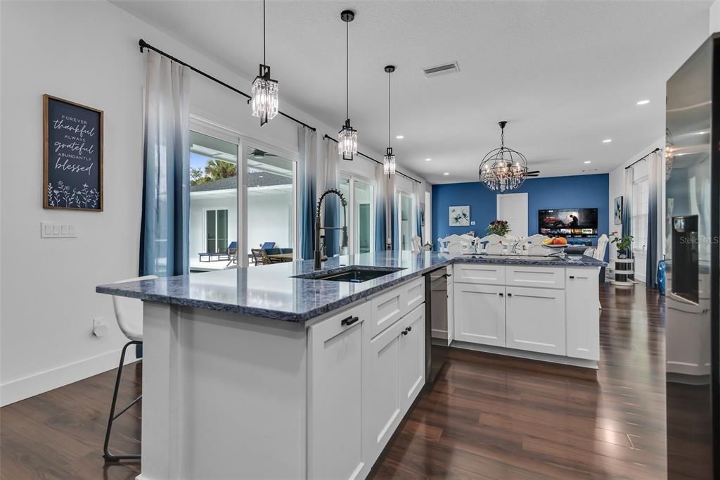Chandelier, Interior, Kitchen, Pendant Lights, Recessed Lighting, Stainless Steel Appliances, Wood Texture Flooring