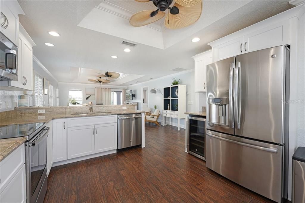 Dining room, Interior, Kitchen, Recessed Lighting, Stainless Steel Appliances, Wood Texture Flooring