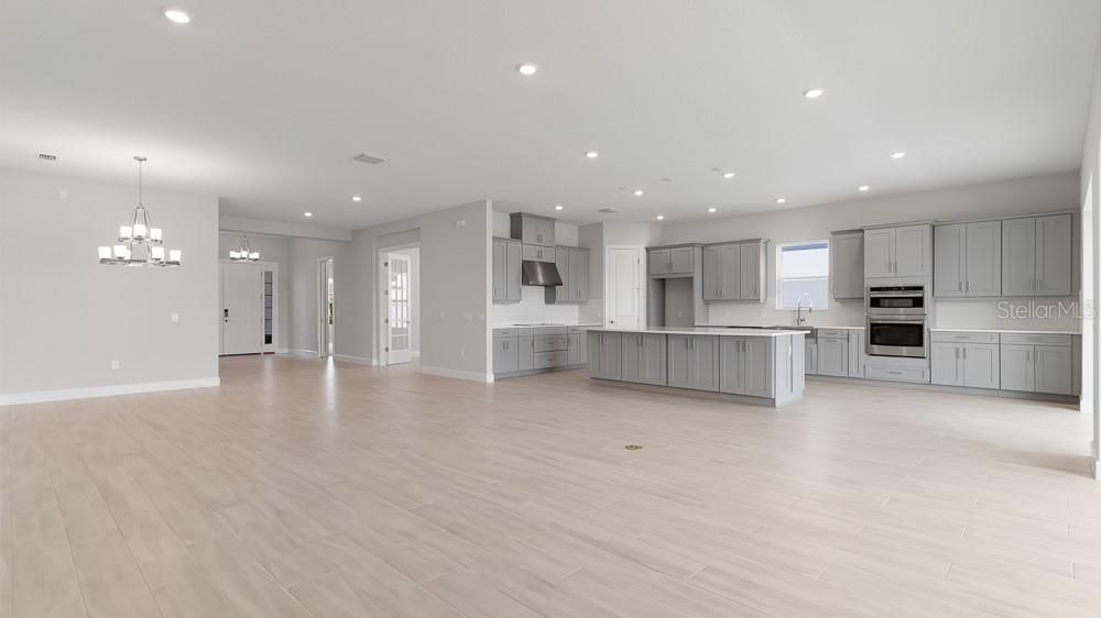 Chandelier, Empty room, Interior, Kitchen, Recessed Lighting, Stainless Steel Appliances, Wood Texture Flooring