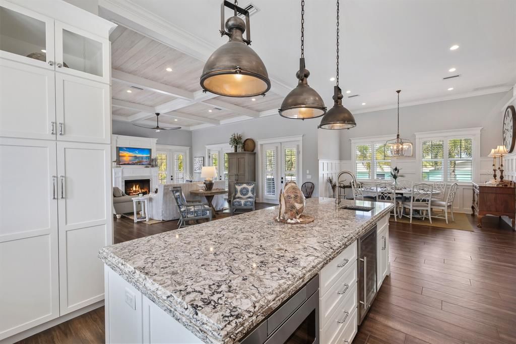 Chandelier, Dining room, Fireplace, Interior, Kitchen, Living room, Pendant Lights, Recessed Lighting, Wood Texture Flooring