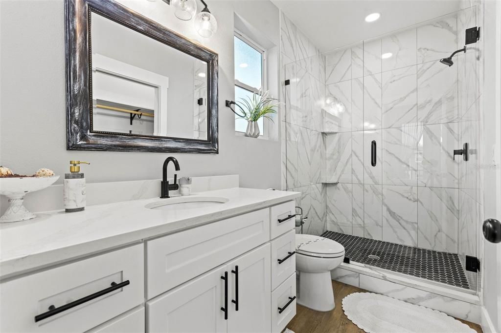 Bathroom, Glass Shower, Interior, Marble Walls, Recessed Lighting, Wood Texture Flooring