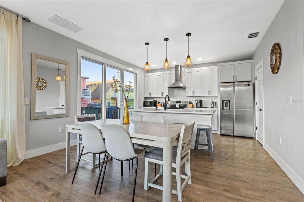 Dining room, Interior, Kitchen, Pendant Lights, Recessed Lighting, Stainless Steel Appliances, Wood Texture Flooring