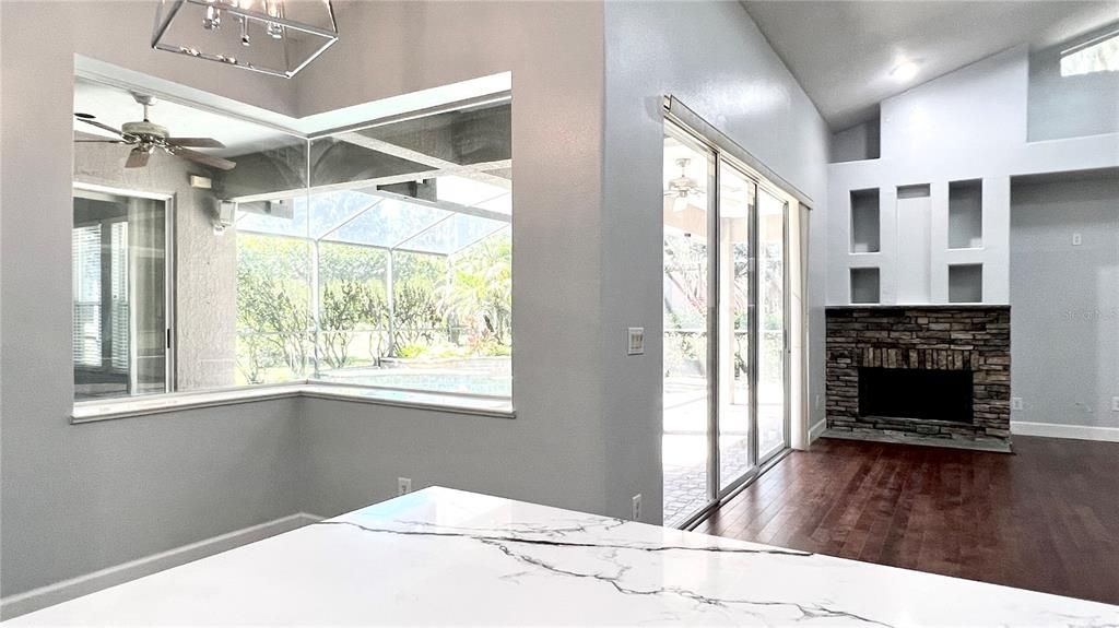 Bedroom, Fireplace, Interior, Recessed Lighting, Sun Room, Wood Texture Flooring