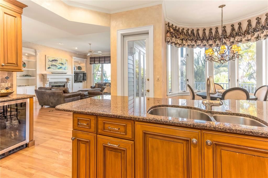 Chandelier, Dining room, Fireplace, Interior, Kitchen, Living room, Pendant Lights, Recessed Lighting, Wood Texture Flooring