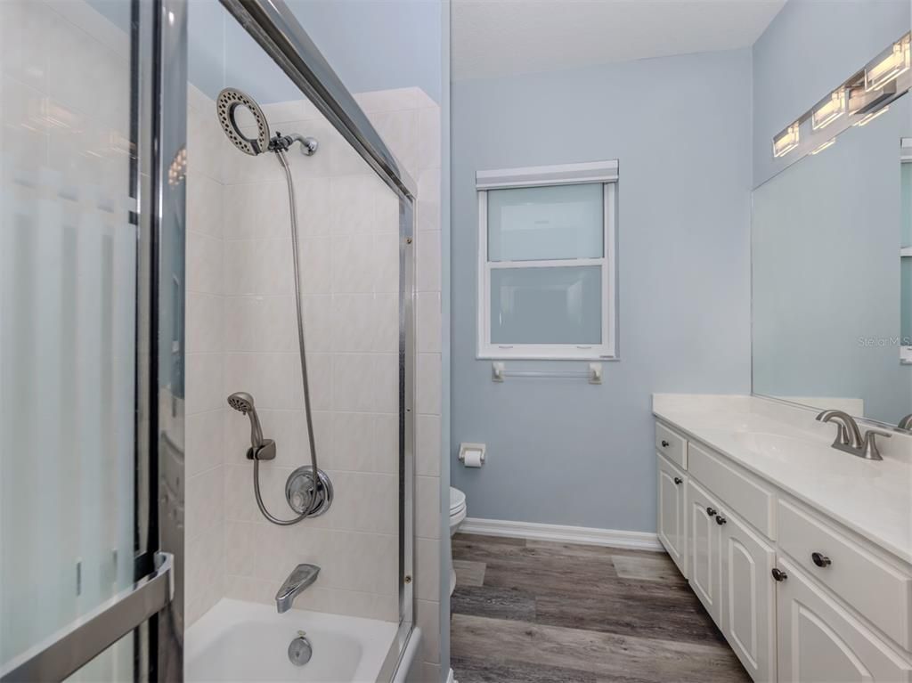 Bathroom, Dual Sink Vanities, Glass Shower, Interior, Wood Texture Flooring