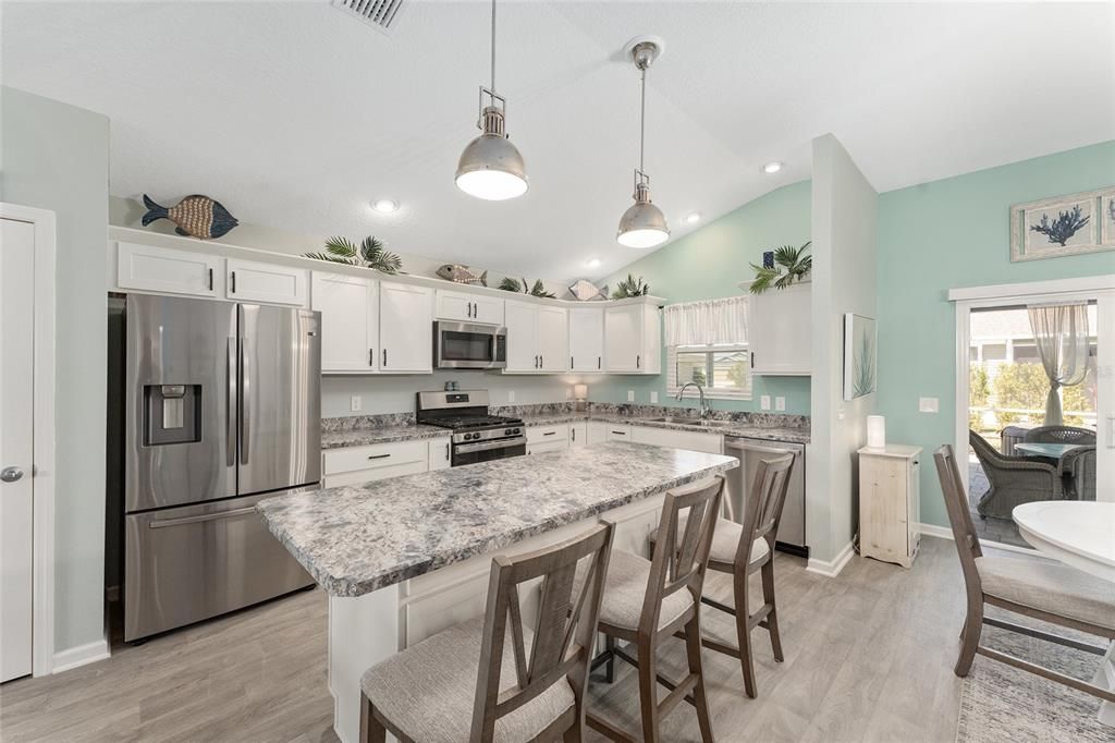 Dining room, Interior, Kitchen, Pendant Lights, Recessed Lighting, Stainless Steel Appliances, Wood Texture Flooring