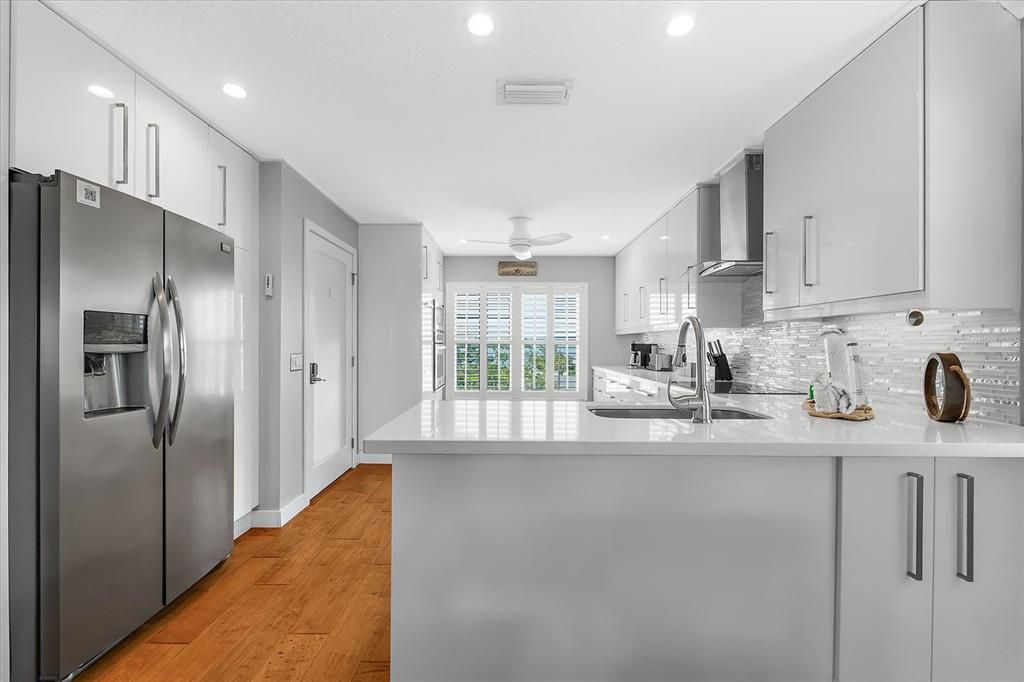 Interior, Kitchen, Recessed Lighting, Stainless Steel Appliances, Wood Texture Flooring