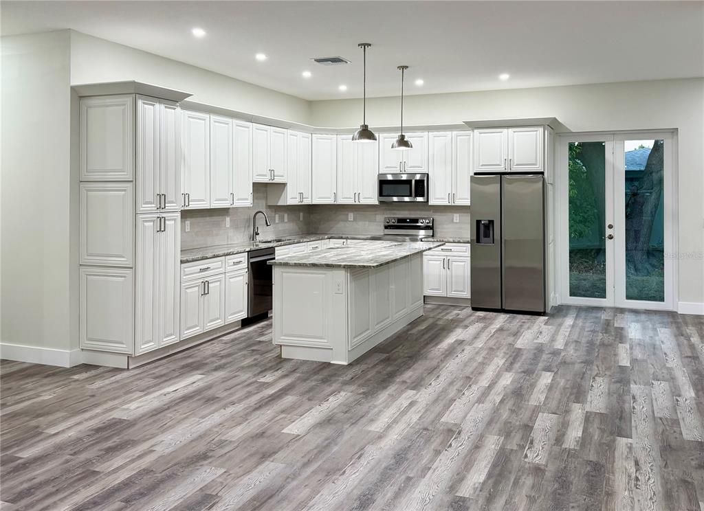 Interior, Kitchen, Pendant Lights, Recessed Lighting, Stainless Steel Appliances, Wood Texture Flooring