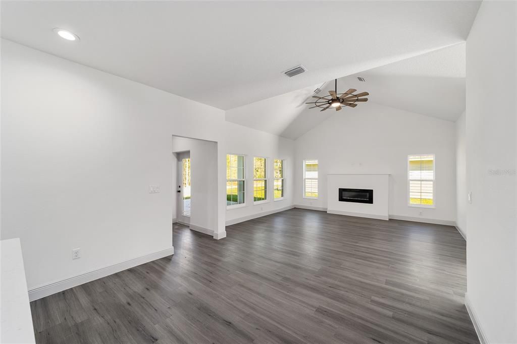 Empty room, Fireplace, Interior, Pendant Lights, Recessed Lighting, Wood Texture Flooring