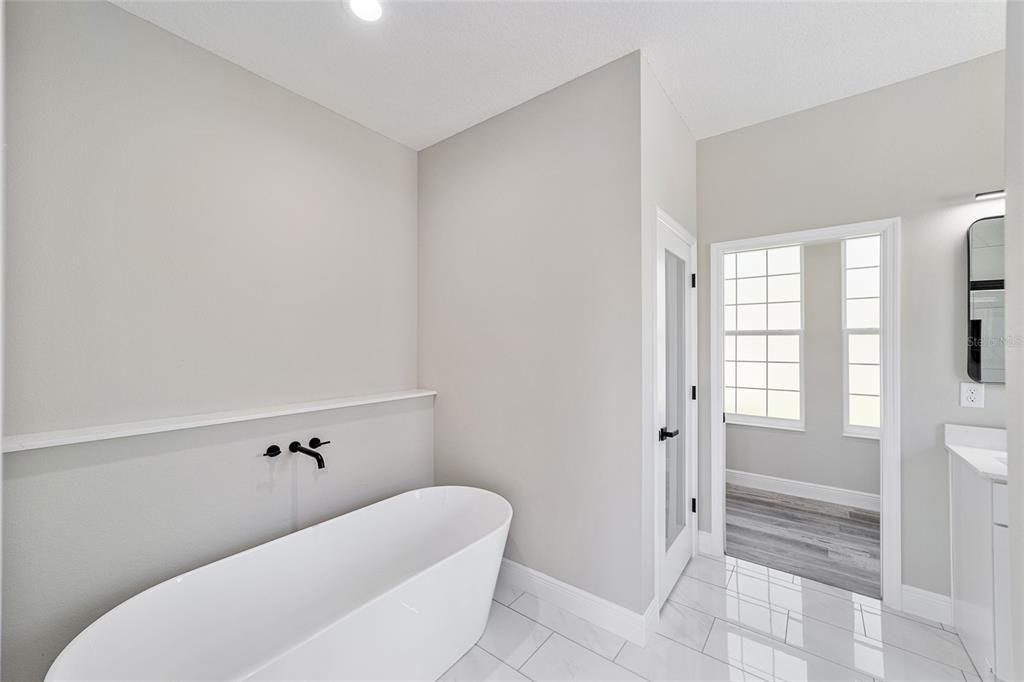 Bathroom, Free Standing Baths, Interior, Marble, Recessed Lighting, Wood Texture Flooring