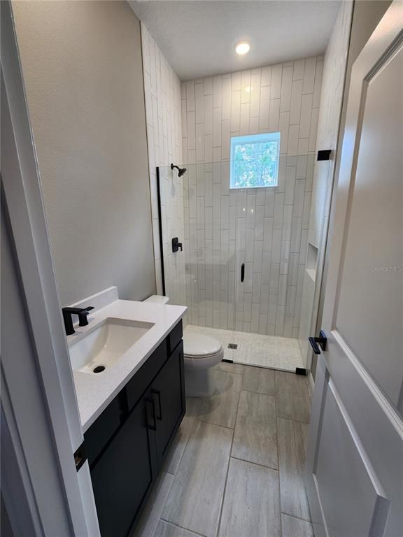 Bathroom, Glass Shower, Interior, Recessed Lighting, Wood Texture Flooring