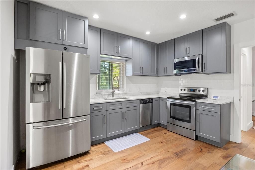 Interior, Kitchen, Recessed Lighting, Stainless Steel Appliances, Wood Texture Flooring
