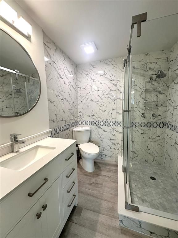 Bathroom, Glass Shower, Interior, Marble Walls, Recessed Lighting, Wood Texture Flooring