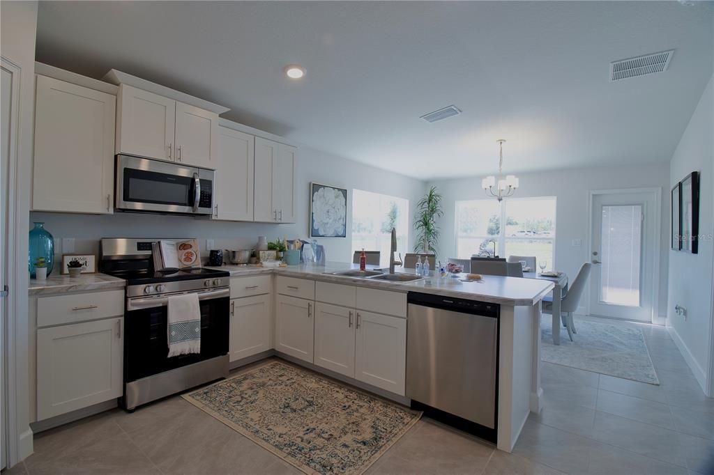 Chandelier, Dining room, Interior, Kitchen, Recessed Lighting, Stainless Steel Appliances