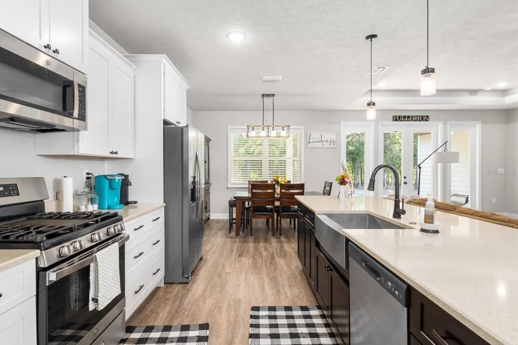 Dining room, Interior, Kitchen, Pendant Lights, Recessed Lighting, Stainless Steel Appliances, Wood Texture Flooring