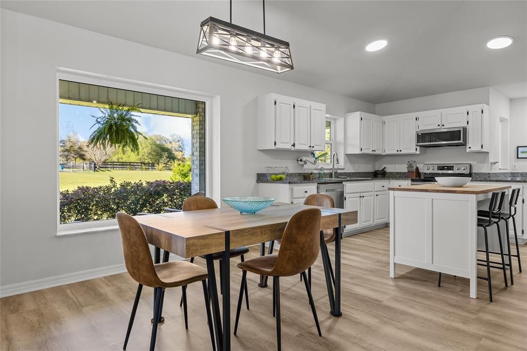 Dining room, Interior, Kitchen, Pendant Lights, Recessed Lighting, Stainless Steel Appliances, Wood Texture Flooring