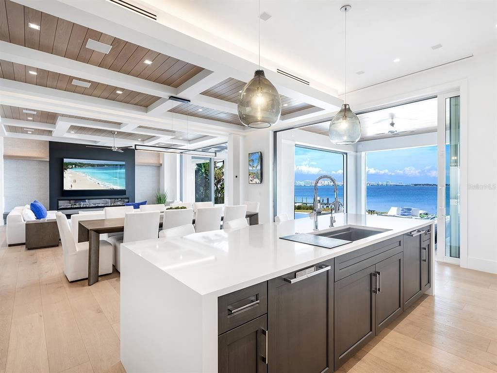 Dining room, Interior, Kitchen, Living room, Pendant Lights, Recessed Lighting, Stainless Steel Appliances, Water, Wooden Ceilings, Wood Texture Flooring