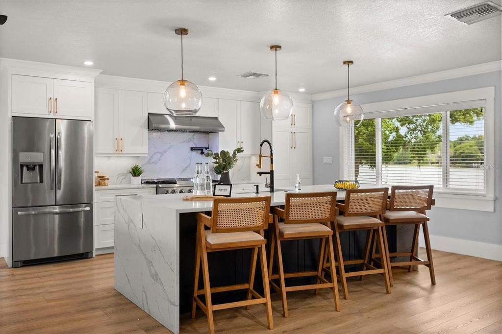 Interior, Kitchen, Marble Walls, Pendant Lights, Recessed Lighting, Stainless Steel Appliances, Wood Texture Flooring