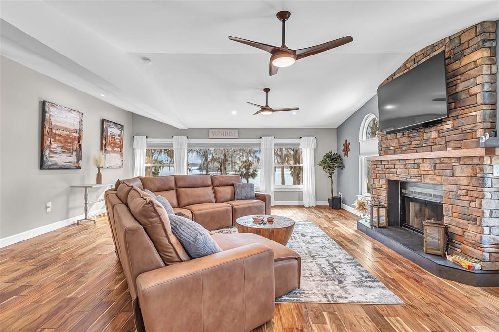 Fireplace, Interior, Living room, Recessed Lighting, Stone Walls, Wood Texture Flooring