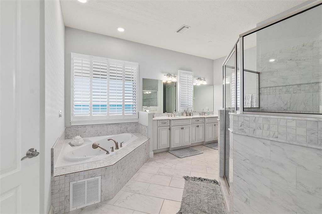 Bathroom, Dual Sink Vanities, Glass Shower, Interior, Marble, Marble Walls, Recessed Lighting