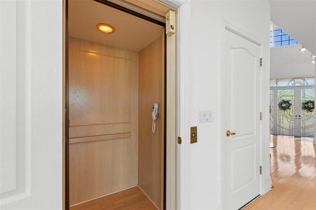 Elevator, Interior, Recessed Lighting, Wood Texture Flooring, Wooden Walls