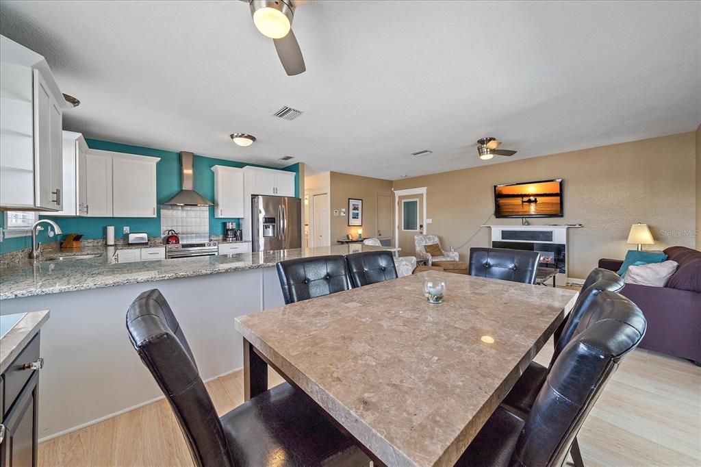 Dining room, Fireplace, Interior, Kitchen, Living room, Stainless Steel Appliances, Wood Texture Flooring