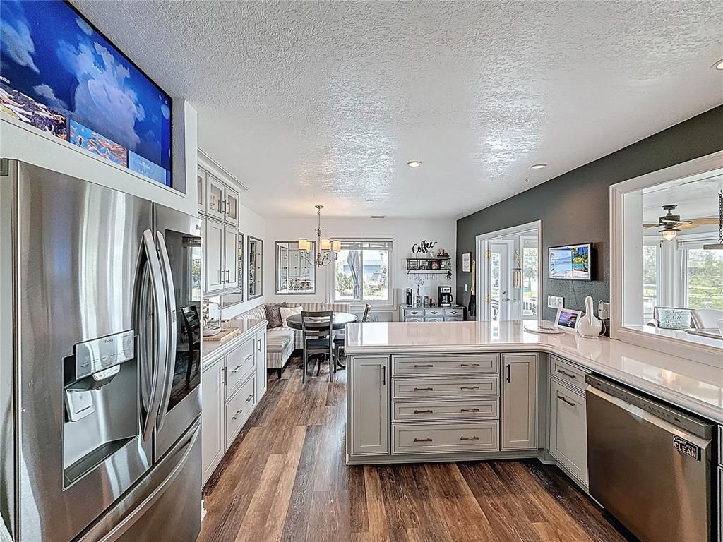 Chandelier, Dining room, Interior, Kitchen, Pendant Lights, Recessed Lighting, Stainless Steel Appliances, Wood Texture Flooring