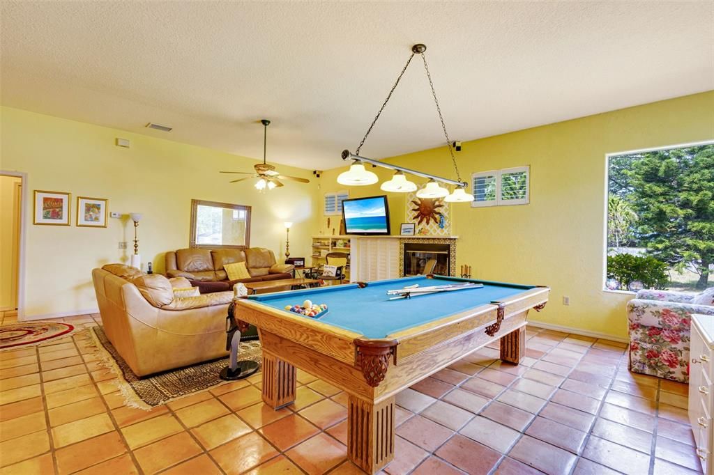 Billiard Table, Chandelier, Fireplace, Game Room, Interior, Living room, Pendant Lights