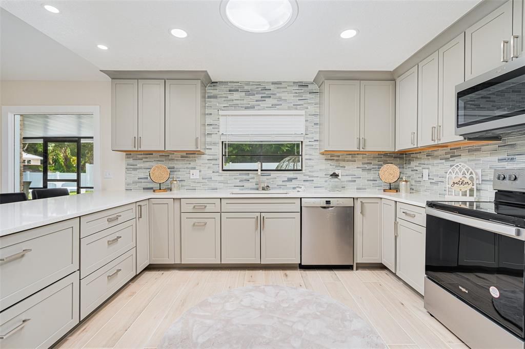 Interior, Kitchen, Recessed Lighting, Stainless Steel Appliances, Stone Walls, Wood Texture Flooring