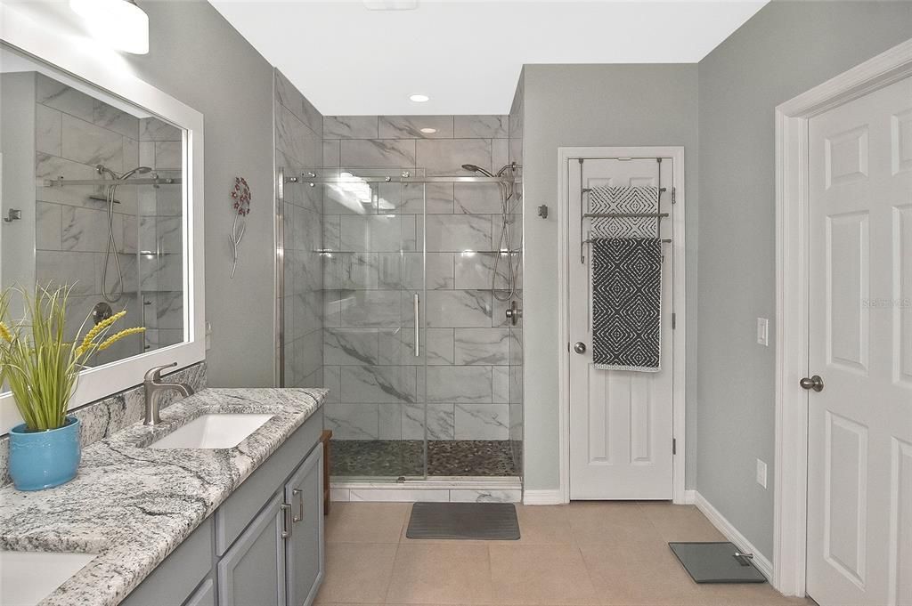 Bathroom, Dual Sink Vanities, Glass Shower, Interior, Marble Walls, Recessed Lighting