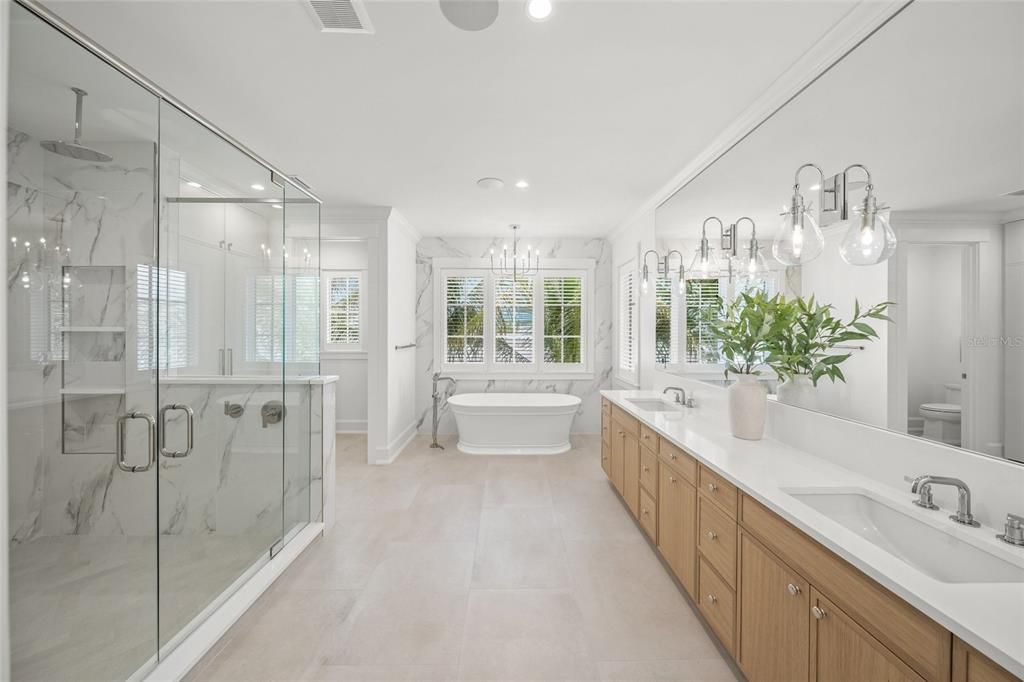Bathroom, Dual Sink Vanities, Free Standing Baths, Glass Shower, Interior, Marble Walls, Recessed Lighting