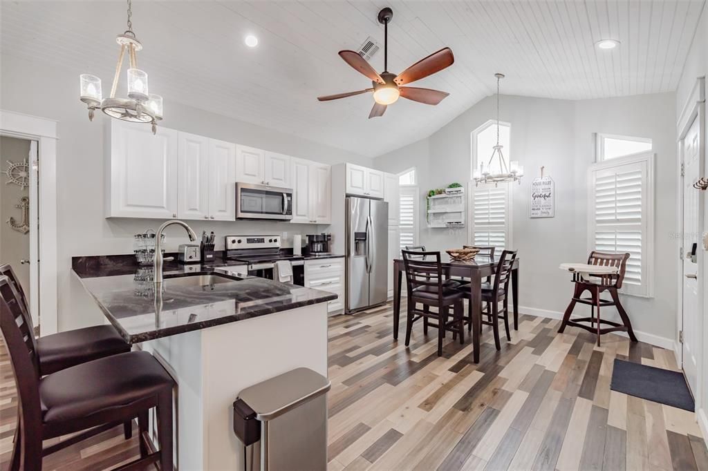Dining room, Interior, Kitchen, Pendant Lights, Recessed Lighting, Stainless Steel Appliances, Wood Texture Flooring