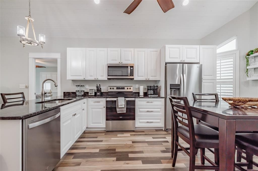 Dining room, Interior, Kitchen, Pendant Lights, Stainless Steel Appliances, Wood Texture Flooring