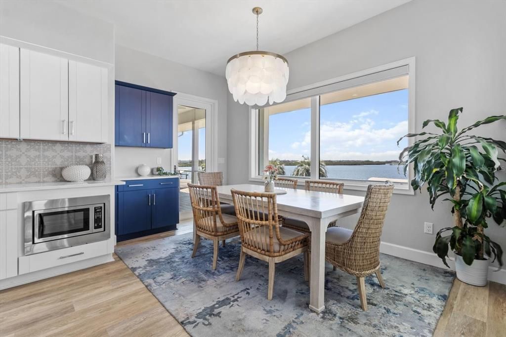 Chandelier, Dining room, Interior, Kitchen, Pendant Lights, Stainless Steel Appliances, Water, Wood Texture Flooring