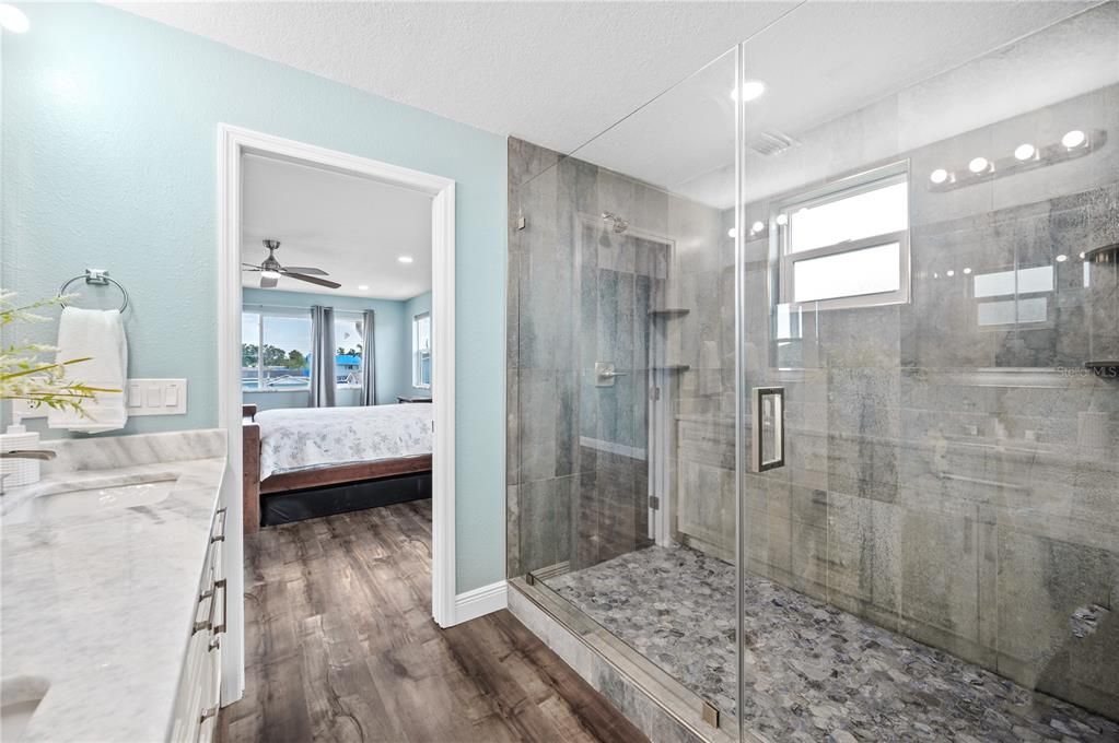 Bathroom, Bedroom, Glass Shower, Interior, Recessed Lighting, Wood Texture Flooring