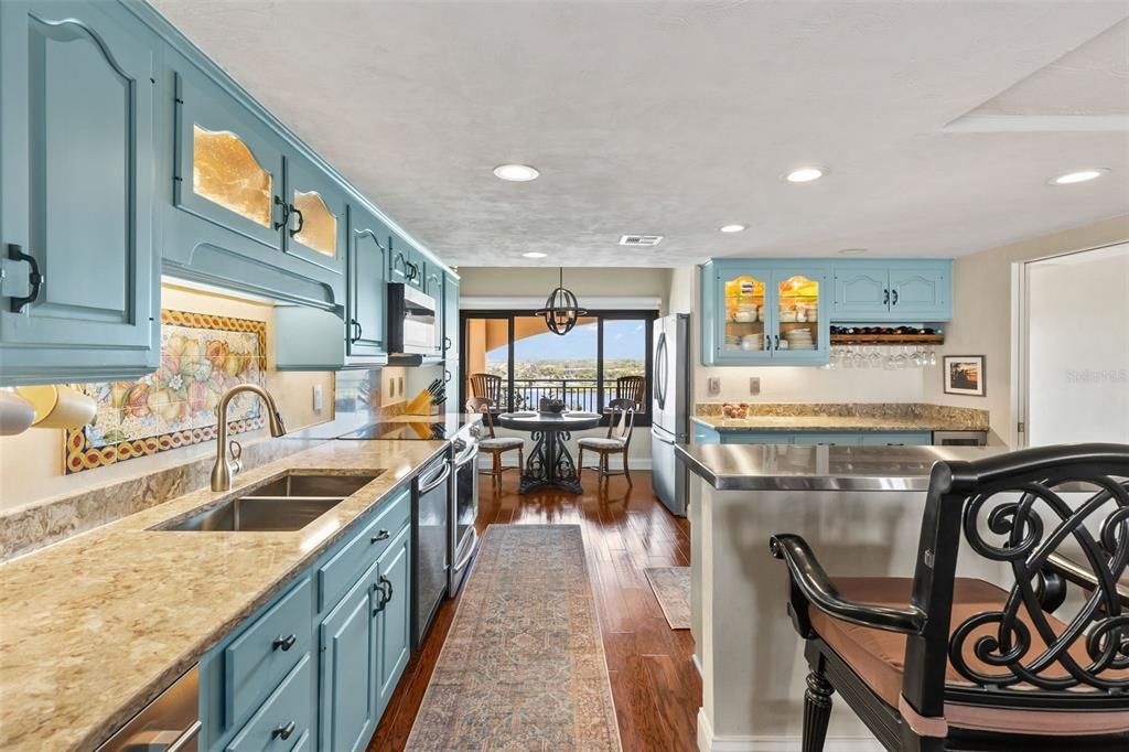 Chandelier, Dining room, Interior, Kitchen, Pendant Lights, Recessed Lighting, Water, Wood Texture Flooring