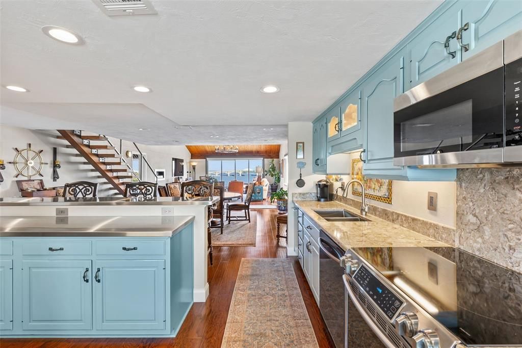 Dining room, Interior, Kitchen, Recessed Lighting, Stainless Steel Appliances, Wood Texture Flooring